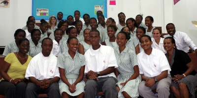 BISX CEO and Listings Manager along with Grade 12 Queen's College students studying Economics and Commerce